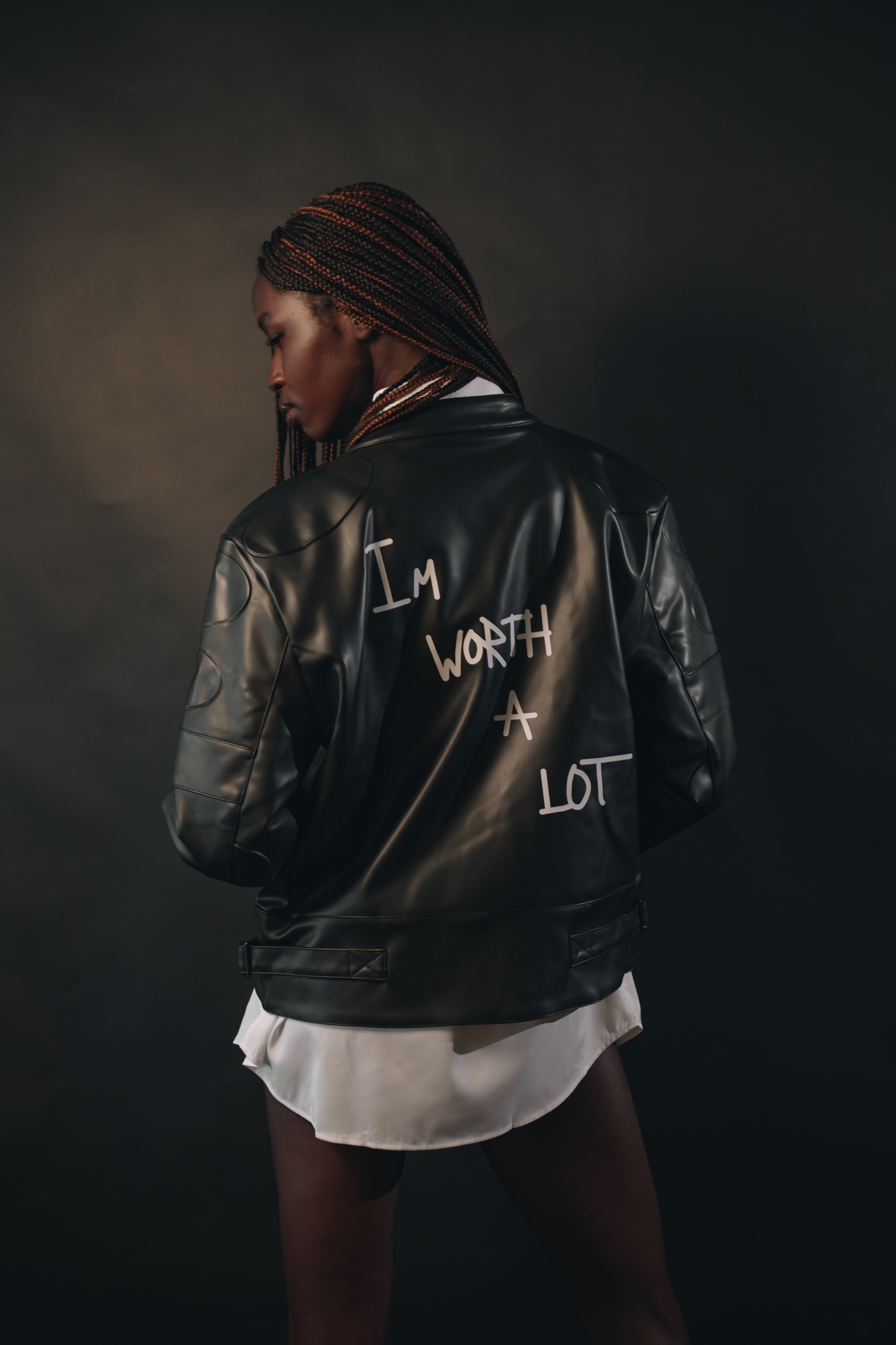 Black Leather Jacket – "I’m Worth A Lot,"